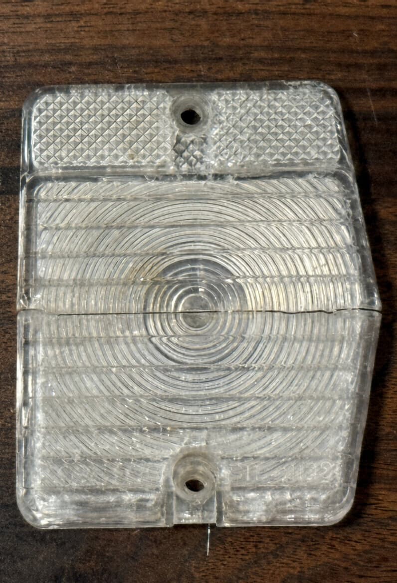 Worn original automotive plastic part